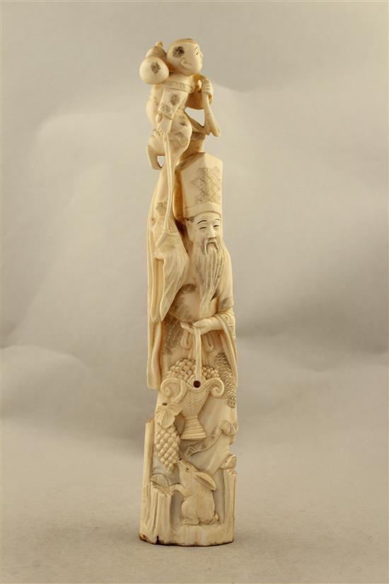 A Japanese walrus ivory tusk carving of Jurojin, early 20th century, 33.5cm